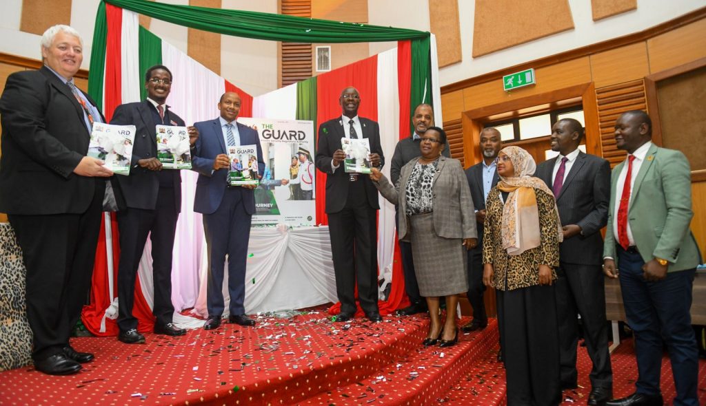PSRA Director General distributes, and displays the Authorities First ever Newsletter after its launch at Kenya School of Government
